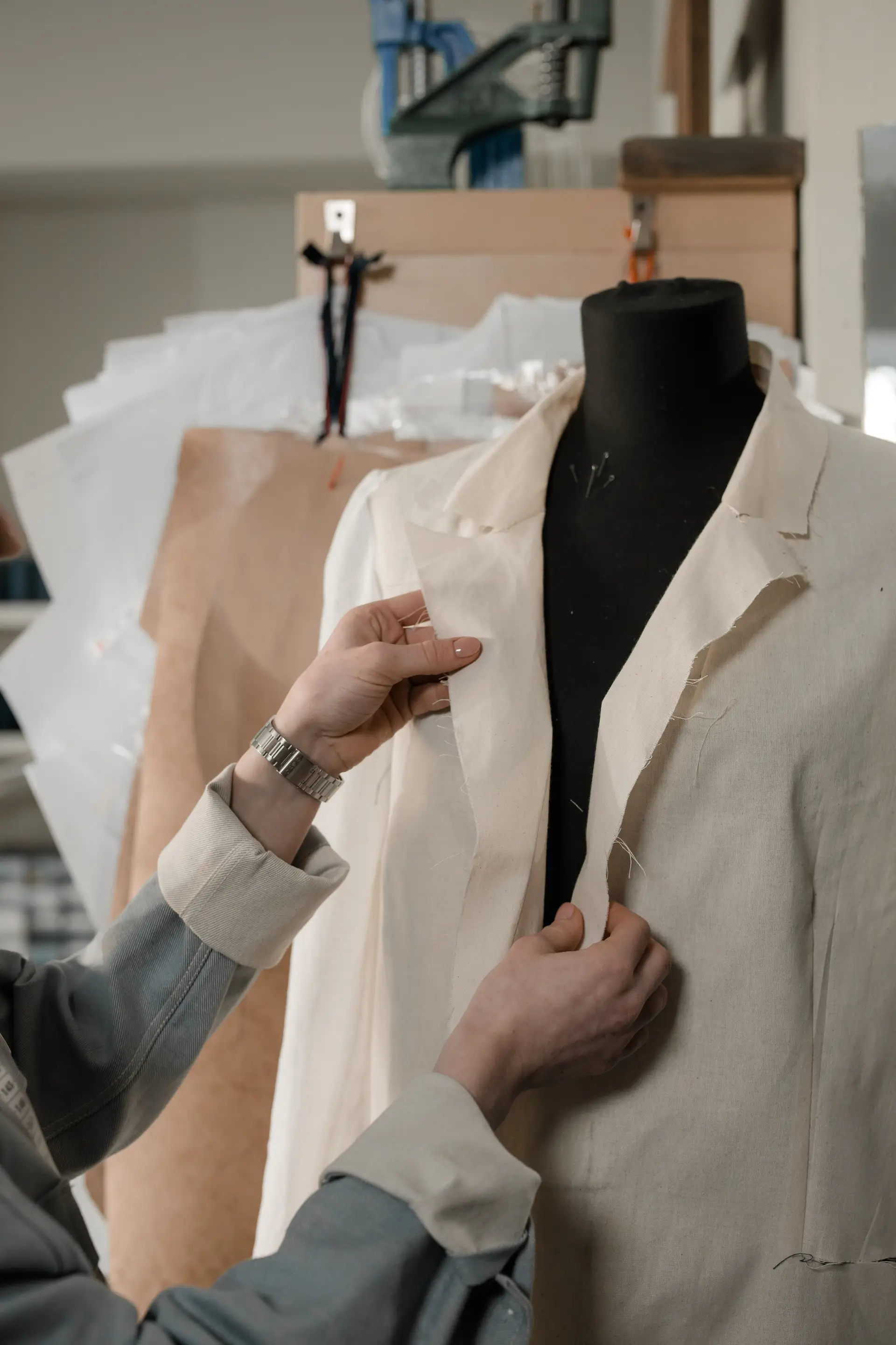 Master tailor adjusting a jacket